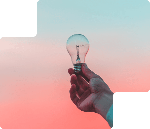 Hand holding a lightbulb